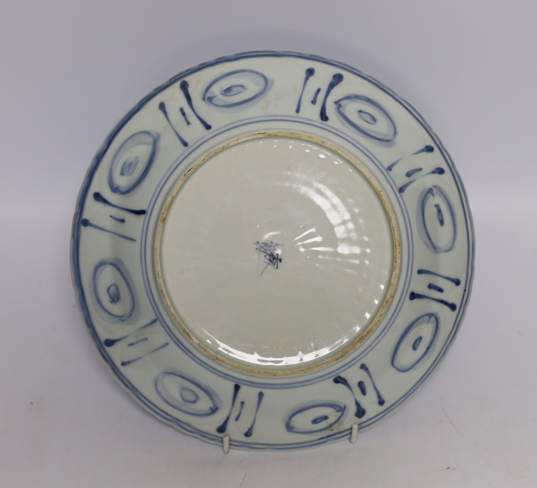 Two Chinese blue and white plates and a similar shallow bowl, largest 26cm high
